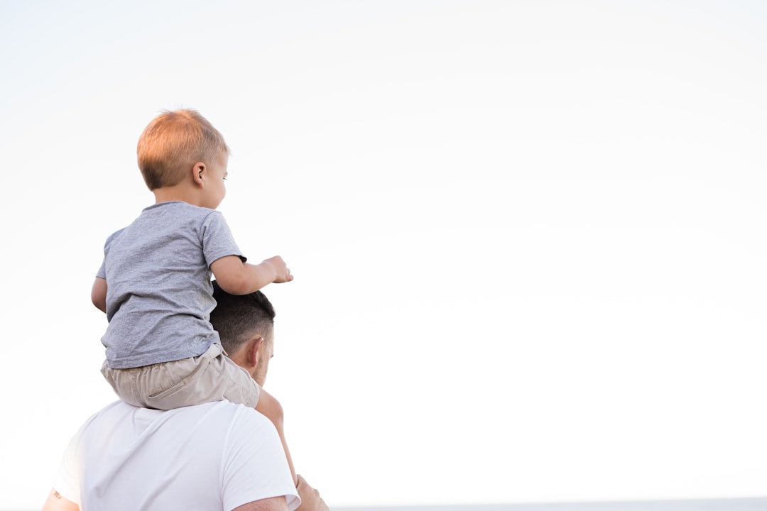 services-01 man carrying child representing divorce and other family law practice areas