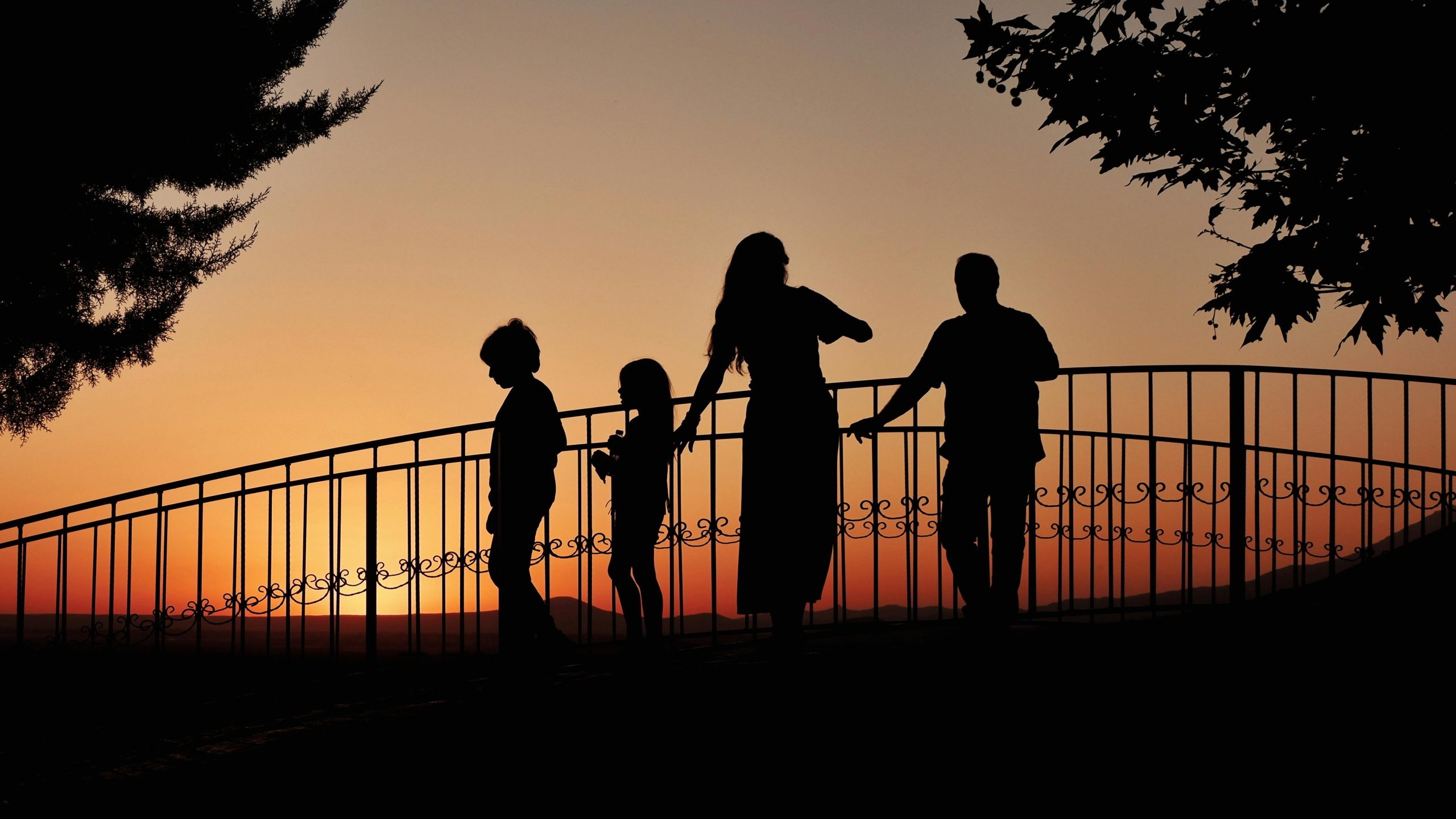mother and two children at sunset to symbolize a divorced couple dealing with family court order enforcement