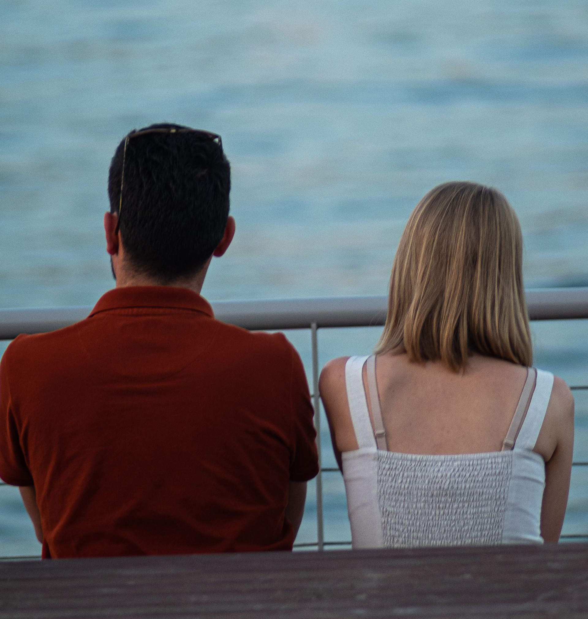 A couple sitting together by the water, to represent the services of a Temecula divorce attorney