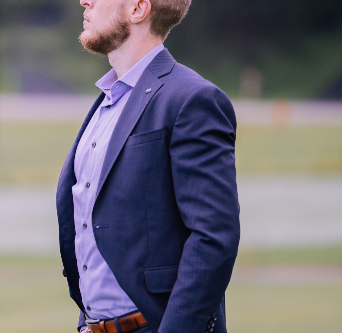 man in suit contemplative as he considers hiring a spousal support attorney